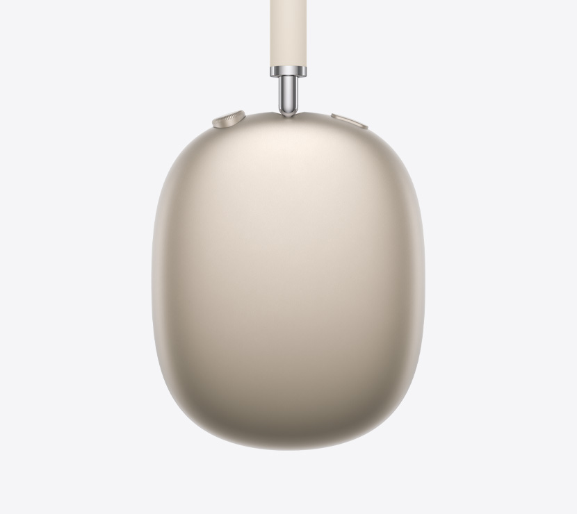 スターライトのAirPods Max 2ヘッドフォン、側面の外観。伸縮アーム、イヤークッション、Digital Crown、ノイズコントロールボタンの細部が見える