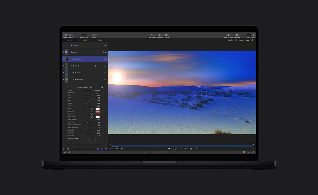 16インチMacBook Pro、雪に覆われた風景のワイドショット。レンズフレアが見えている