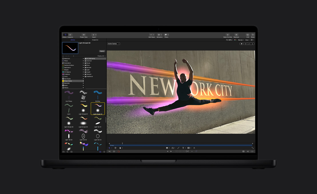 16インチMacBook Pro、ジャンプしている男性ダンサーの輪郭が光っている、ペイントツールのデモ