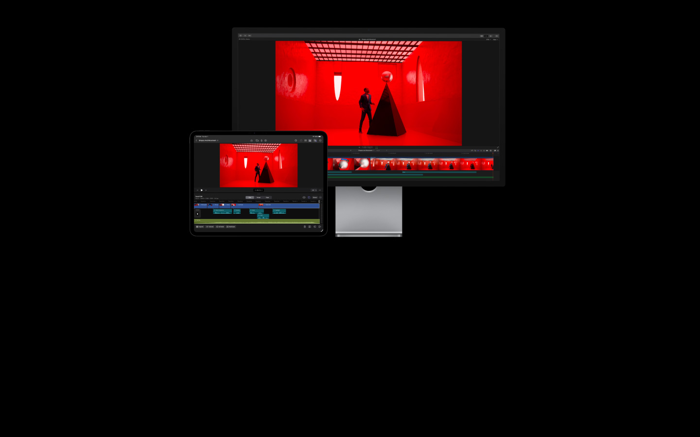 Final Cut Proでの編集作業が進行中。赤い部屋にいる青いスーツを着た男性が巨大な白い真珠を黒いピラミッドの上に置いている