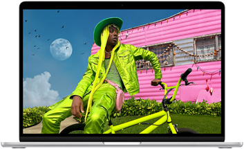 カラフルな服を着た人物の写真を表示したMacBook Airの画面。Liquid Retinaディスプレイの色域と解像度を見せている